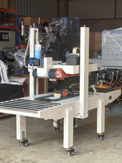 เครื่องปิดปากกล่อง FXJ6050