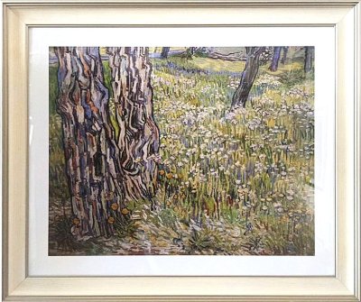 Flowering meadow with trees and dandelions