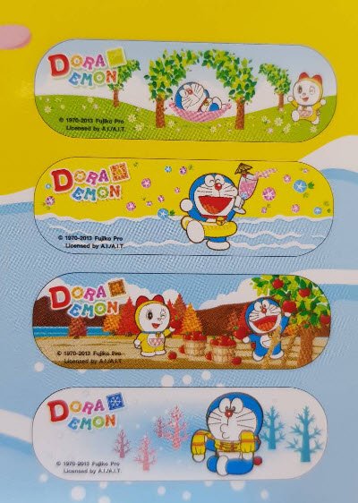 พลาสเตอร์ใสปิดแผล SOS PLUS  2.5x5.6 ซม. โดราเอมอน ( P1 DM-01 )