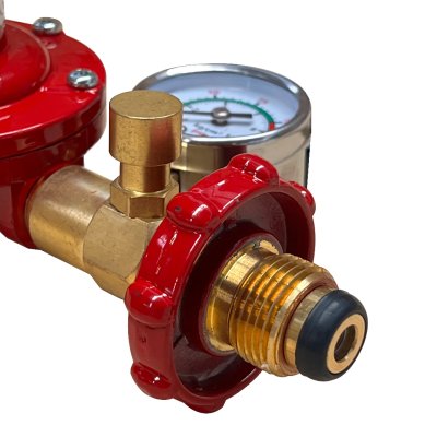 High pressure gas regulator with safety valve and pressure gauge