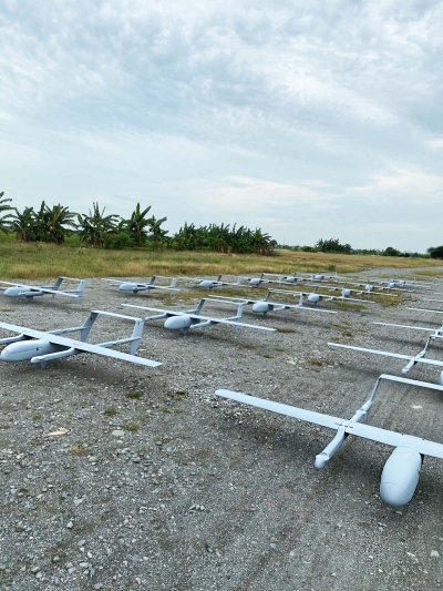 Side view of planes with clear skies in the field
