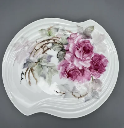 Hand painted Roses- An oval-like porcelain plate with a soft, curved edge
