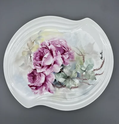 Hand painted Roses- An oval-like porcelain plate with a soft, curved edge