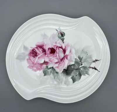 Hand painted Roses- An oval-like porcelain plate with a soft, curved edge
