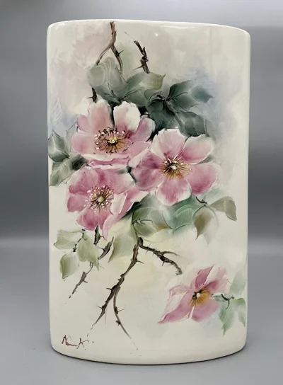 A flat-shaped vase with a wild rose motif