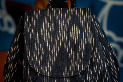 กระเป๋าเป้มัดหมี่ฝ้ายย้อมคราม Indigo-dyed cotton tie-dye backpack.