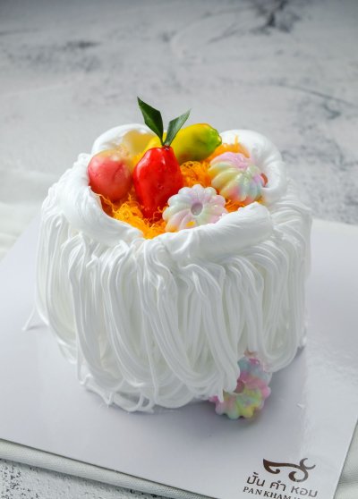 Fresh milk cake with whipped cream and Thai dessert topping