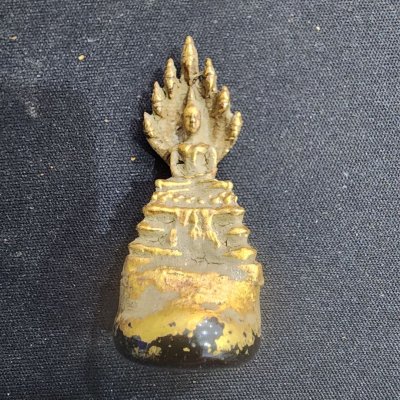 พระนาคปรกเนื้อชิน บนพระธาตุ กรุดอยไซ