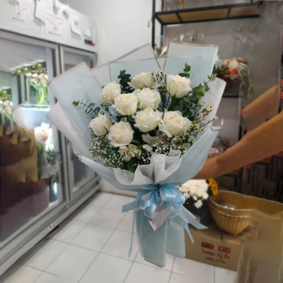 A bouquet of 9 white roses