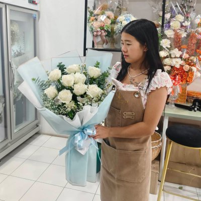 A bouquet of 9 white roses