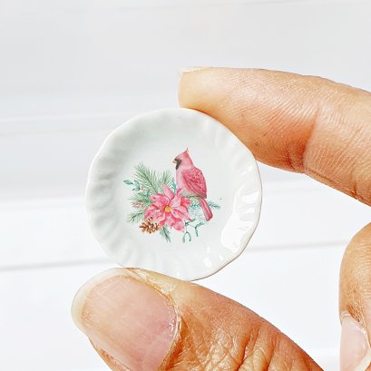 Tiny decorative ceramic plate with a vibrant red bird and floral design, ideal for dollhouse displays, collectibles, or as a unique gift.