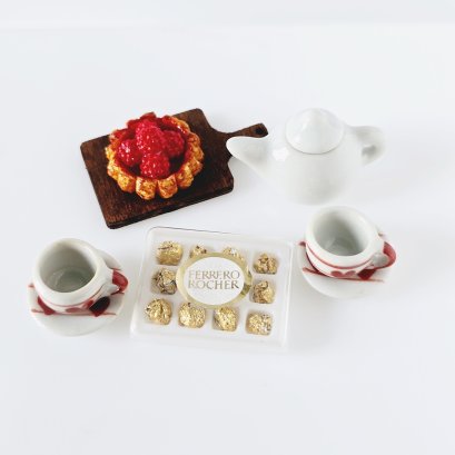 Miniature tea and pastry set with chocolates for 1:12 scale dollhouse decor. Perfect for tea parties and kitchen scenes.