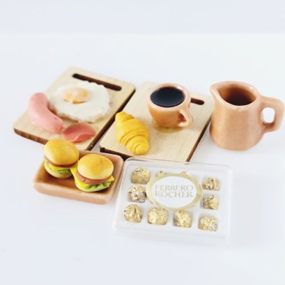 Miniature tea and pastry set with chocolates for 1:12 scale dollhouse decor. Perfect for tea parties and kitchen scenes.