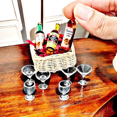 Miniature wine bottle and glass set for 1:12 scale dollhouse bar decor, featuring three wine bottles and various glasses.