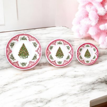 Miniature Christmas plates with red and green tree designs, set of 3. Perfect for dollhouse holiday decor or festive miniature table settings.