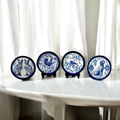 Set of four miniature ceramic plates with intricate blue animal designs, featuring cats, dogs, birds, and roosters, perfect for dollhouse decor.