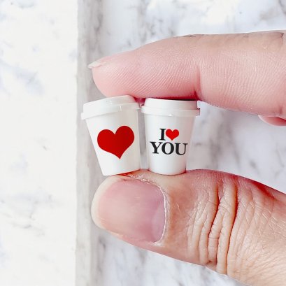 Set of two miniature coffee cups with love-themed designs, featuring 'I ❤️ YOU' and a heart, perfect for Valentine's Day dollhouse decor