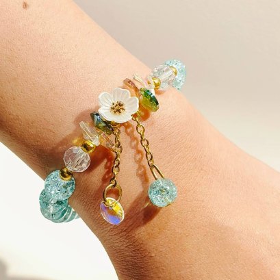 Light Blue Beaded Bracelet with White Flower Charm