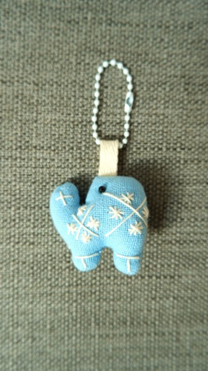 blue elephant keychain, white cord