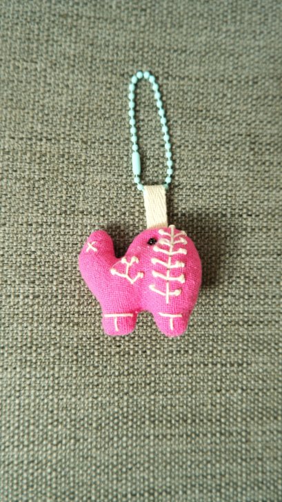 pink elephant keychain, blue cord