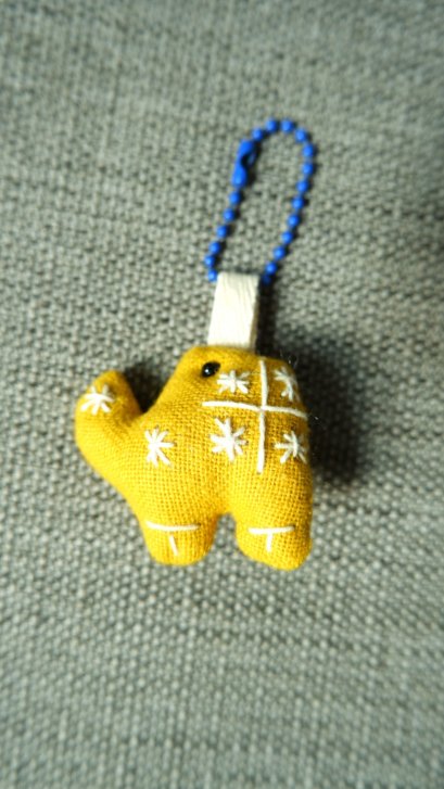 Yellow elephant keychain, blue cord