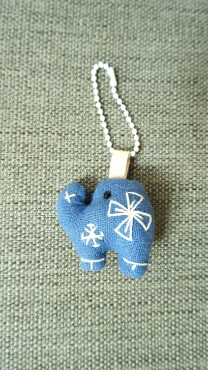 blue elephant keychain, white cord