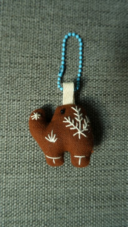 brown elephant keychain, blue cord