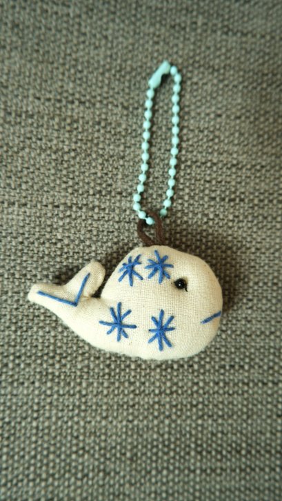 white cloth keychain, light blue cord