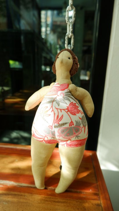 Doll with orange dress