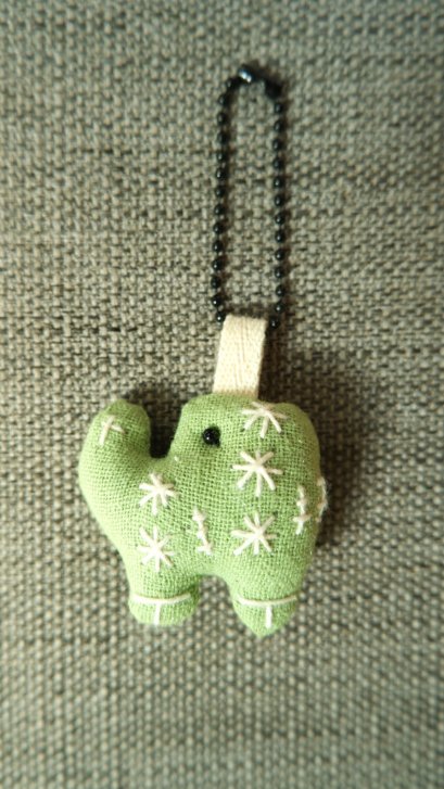 green elephant keychain, black cord