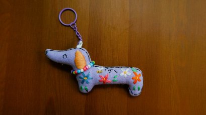 Embroidered purple dog