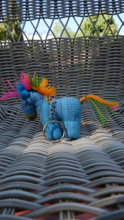 Blue horse keychain with pink, orange &amp; green tail