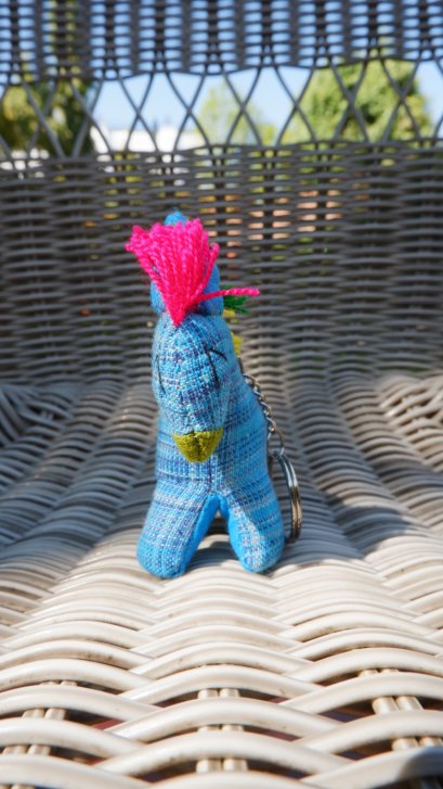 Blue horse keychain with red, yellow &amp; green tail