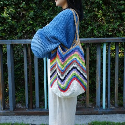 Crocheted bag with brown strap