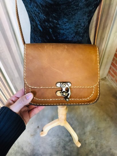 Square leather bag with white lines