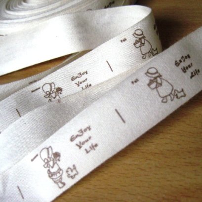 ป้ายผ้าน้องซู หน้ากว้าง 2 ซม.ราคาหลาละ