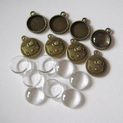 หัวซิปทองดำ พร้อมกระจก แบบกลมด้านหลังลาย kitty ขนาด 14 mm. 8 ชุด/set