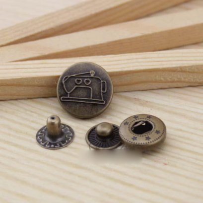 กระดุมตอก ลายจักร ขนาด 1.5 cm. ราคา/ชุด