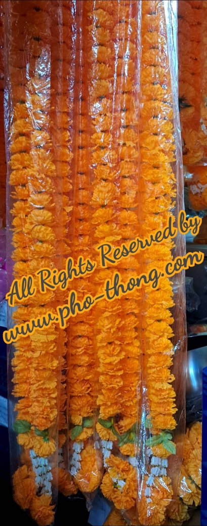 Multiple yellow marigold fabric garlands packed closely in clear plastic sleeves