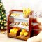 Handcrafted miniature bakery display with assorted breads, donuts, and pastries, perfect for dollhouse or diorama settings.