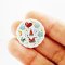 Miniature ceramic plates with adorable gnome and nature illustrations, ideal for enchanted dollhouse or woodland-themed setups.