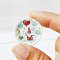 Miniature ceramic plates with adorable gnome and nature illustrations, ideal for enchanted dollhouse or woodland-themed setups.