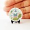 Miniature ceramic plates with adorable gnome and nature illustrations, ideal for enchanted dollhouse or woodland-themed setups.