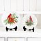 Miniature Christmas plates with cardinal designs, perfect for dollhouse holiday decor and adding festive cheer to miniature scenes.