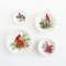 Miniature Christmas plates with cardinal designs, perfect for dollhouse holiday decor and adding festive cheer to miniature scenes.