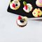 Miniature Assorted Sweet Cupcake on Black Tray