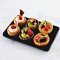 Miniature Assorted Sweet Fruit Tart on Black Tray