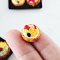 Miniature Assorted Sweet Fruit Tart on Black Tray