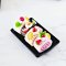 Miniature Assorted Roll Cake on Black Tray