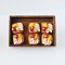 miniature fruit pastries on wooden tray